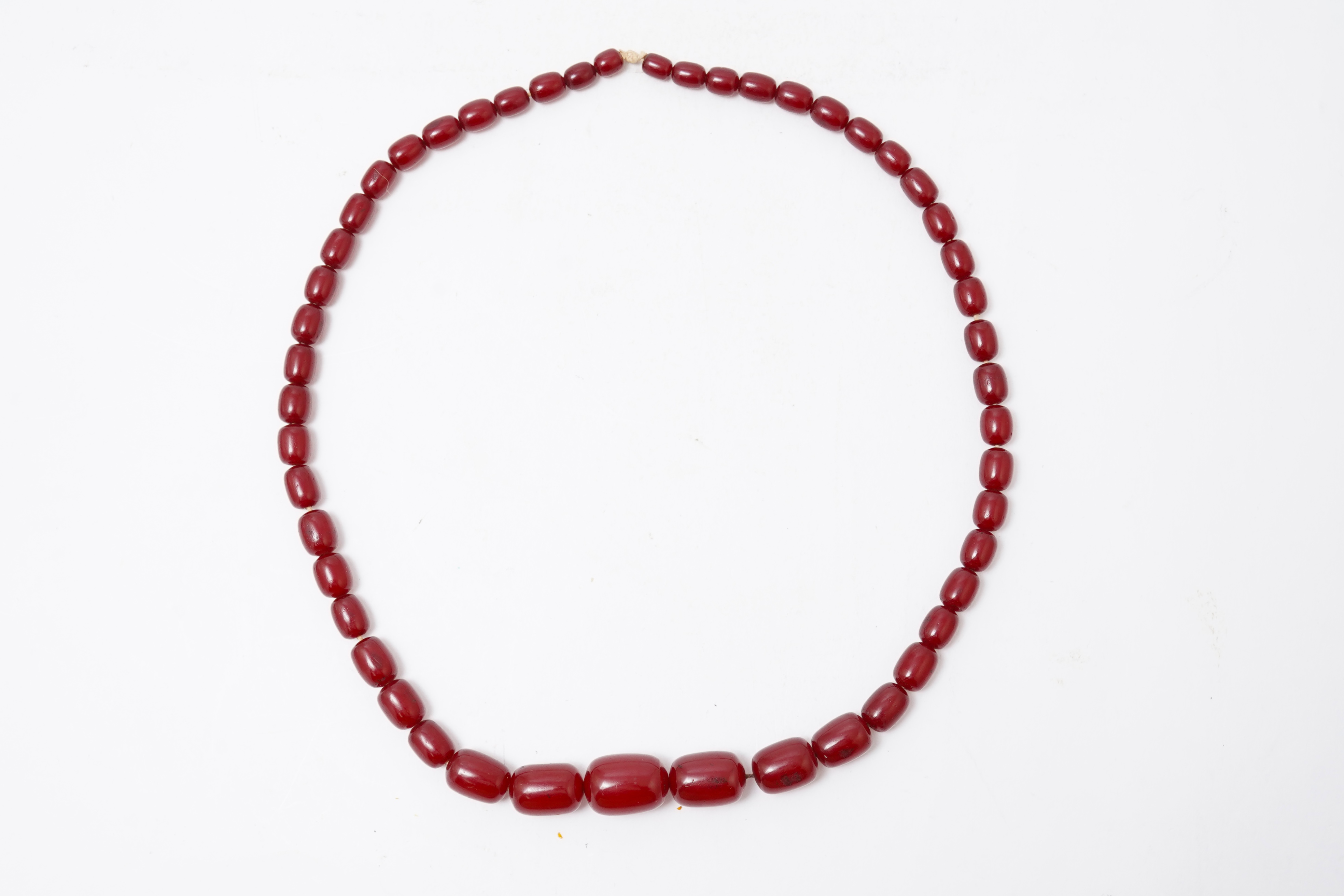 A cherry-coloured bakelite 'amber' necklace